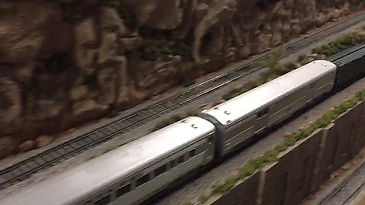 Passenger train across white bridge